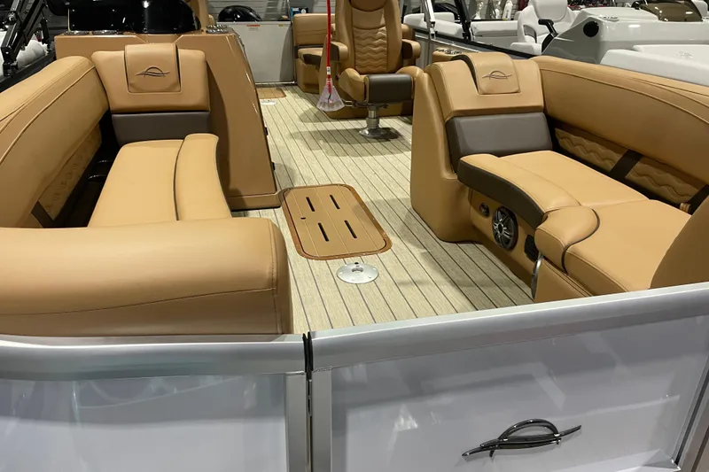 Slide: The Image of Luxurious interior of 2025 SunCatcher Fusion 322RC pontoon boat with tan seating. - 4