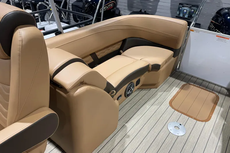 Slide: The Image of Luxurious seating in 2025 SunCatcher Fusion 322RC boat, featuring tan upholstery and modern design. - 6