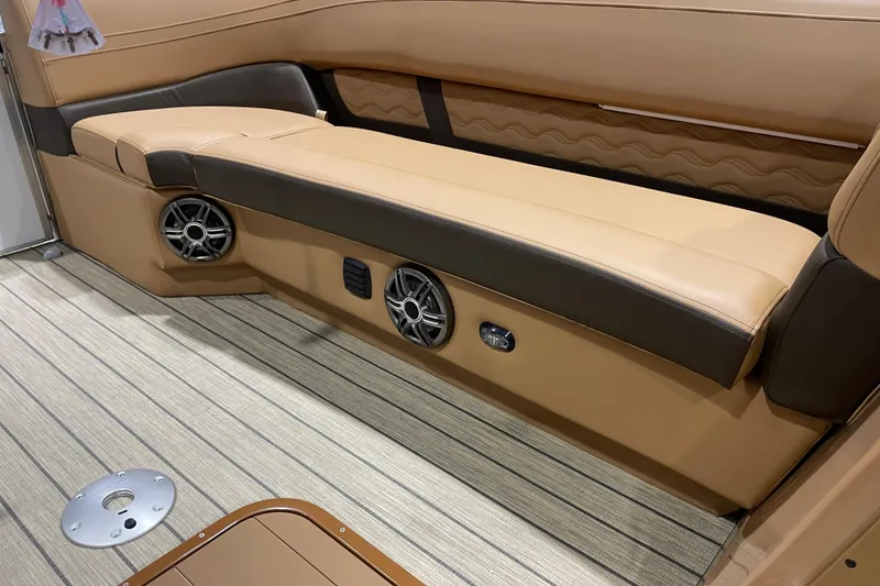 Slide: The Image of Luxurious interior of 2025 SunCatcher Fusion 322RC boat with premium seating and speakers. - 9