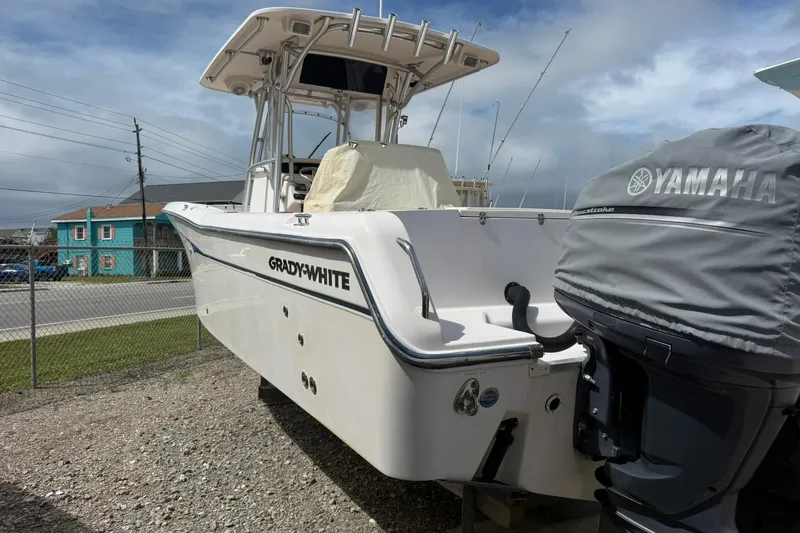 Slide: The Image of 2008 Grady-White Release 283 boat with Yamaha engine, parked outdoors. - 3