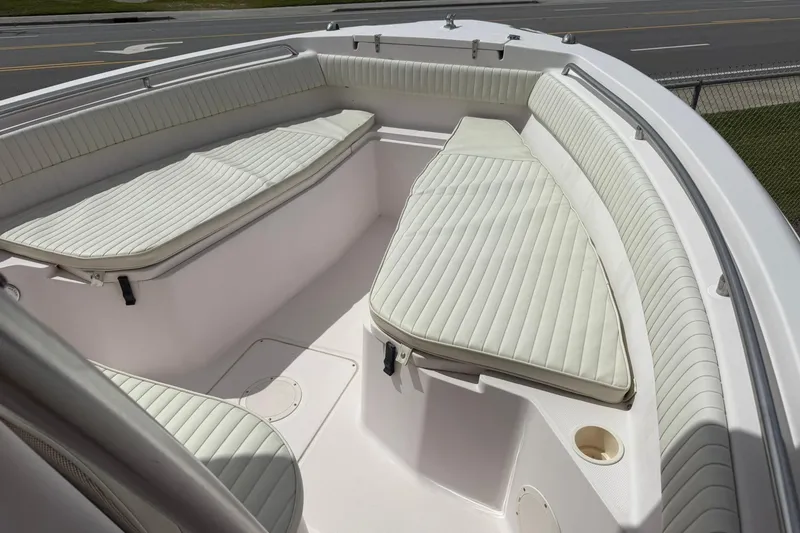 Slide: The Image of 2008 Grady-White Release 283 boat interior with cushioned seating and sleek design. - 5