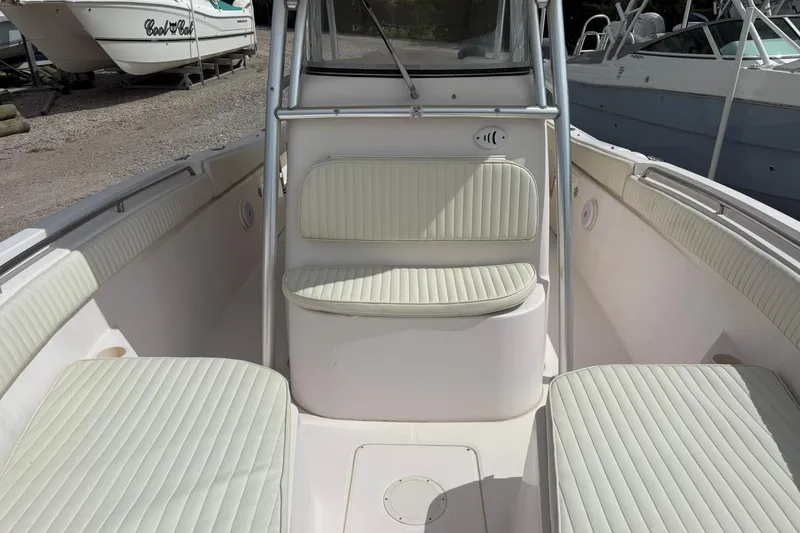 Slide: The Image of 2008 Grady-White Release 283 boat interior with cushioned seating and sleek design. - 6