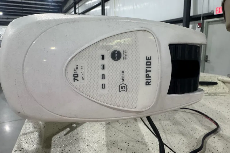 Slide: The Image of Riptide motor with 70 lbs thrust, 24 volts, 5-speed settings, in a warehouse. - 8