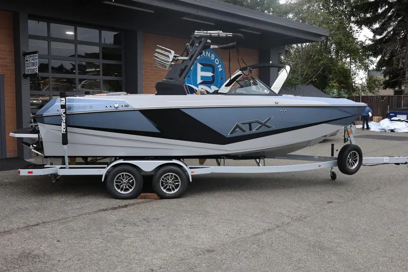 The Image of 2026 ATX Surf Boats 22 Type-S on trailer, parked outside a building. - 1