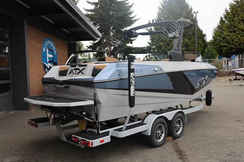 Slide: The Image of 2026 ATX Surf Boats 22 Type-S on trailer, parked outdoors near a building. - 22