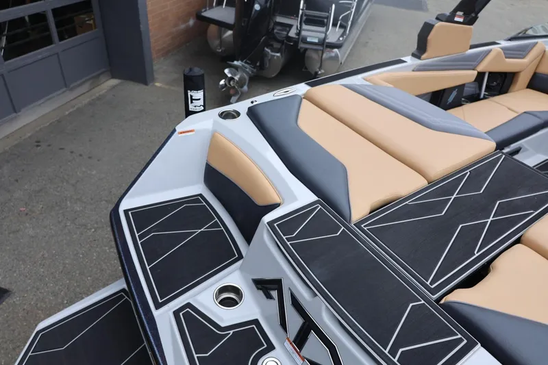 Slide: The Image of 2026 ATX Surf Boats 22 Type-S interior with tan and black seating, modern design. - 25