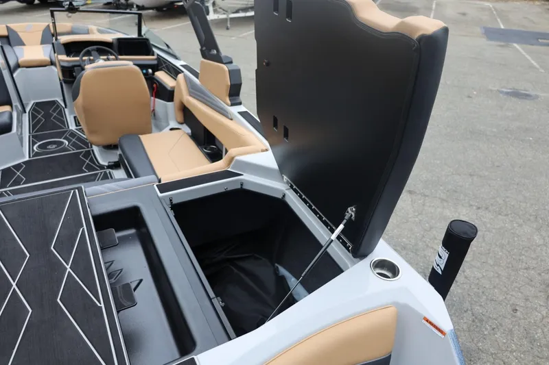 Slide: The Image of 2026 ATX Surf Boats 22 Type-S interior with open storage compartment and tan seating. - 28