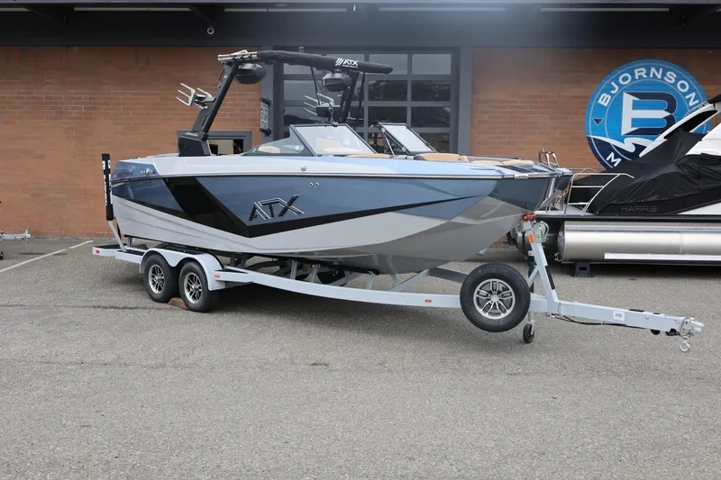 Slide: The Image of 2026 ATX Surf Boats 22 Type-S on trailer, parked outside a building. - 3