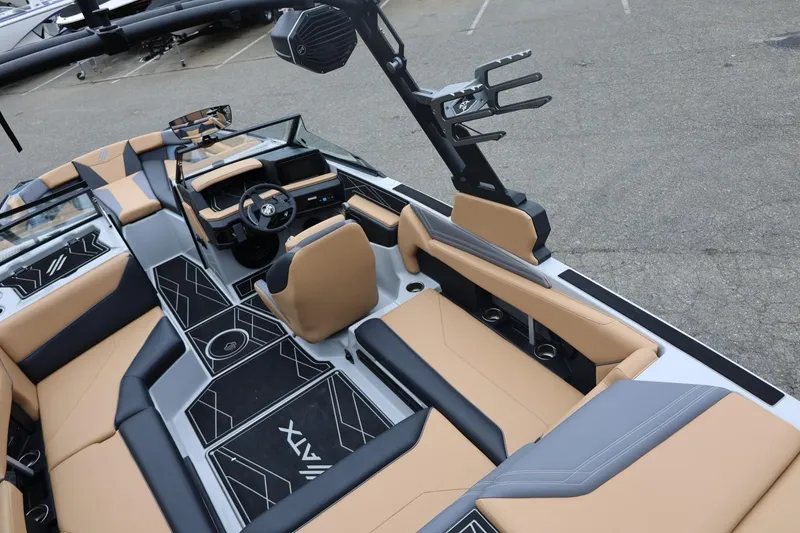 Slide: The Image of 2026 ATX Surf Boats 22 Type-S interior with tan and black seating, sleek design, and modern dashboard. - 31