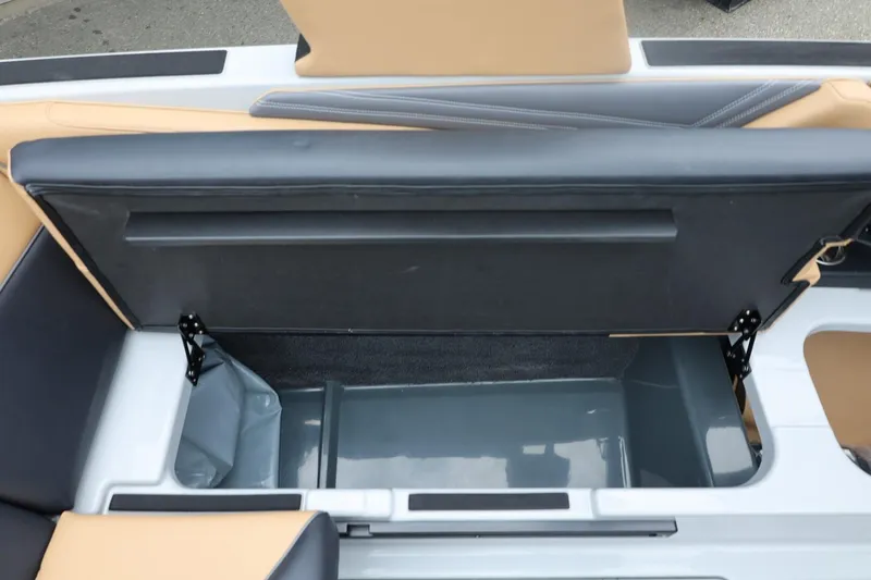 Slide: The Image of 2026 ATX Surf Boats 22 Type-S storage compartment with open seat revealing interior space. - 35