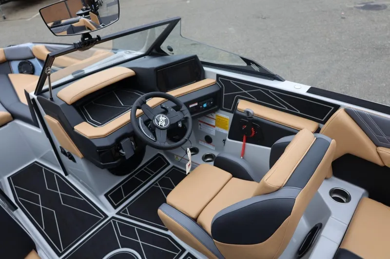Slide: The Image of 2026 ATX Surf Boats 22 Type-S interior with modern dashboard and tan seating. - 37