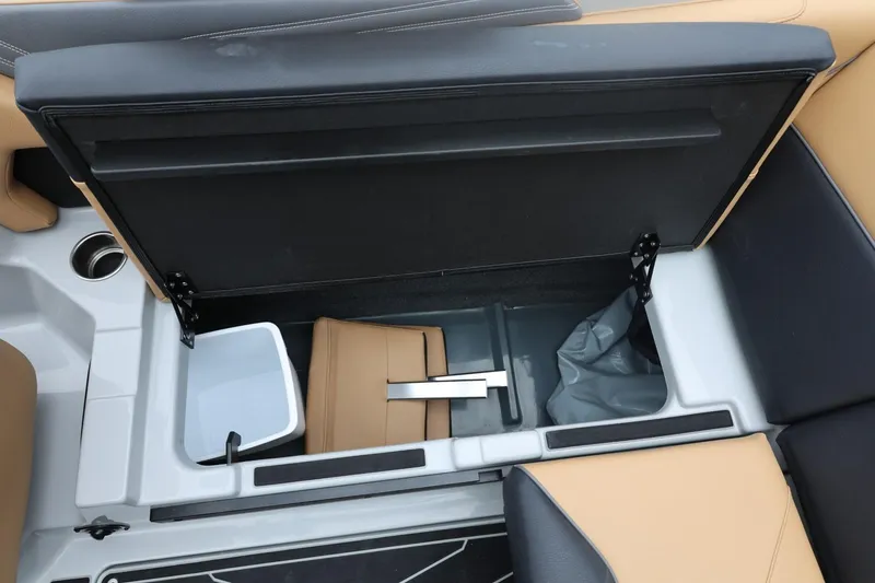 Slide: The Image of 2026 ATX Surf Boats 22 Type-S interior storage compartment with open lid and seating. - 38