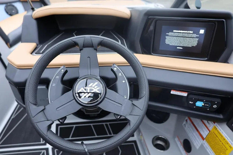 Slide: The Image of 2026 ATX Surf Boats 22 Type-S dashboard with steering wheel and digital display. - 43