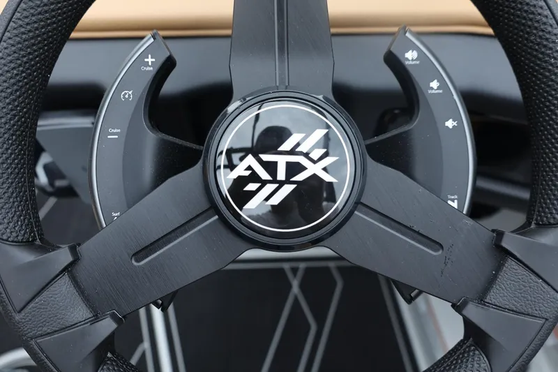Slide: The Image of Steering wheel of 2026 ATX Surf Boats 22 Type-S with control buttons. - 48