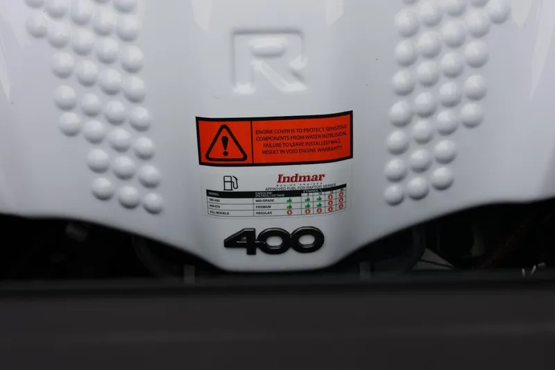 Slide: The Image of 2026 ATX Surf Boats 22 Type-S engine cover with Indmar warning label and fuel chart. - 62