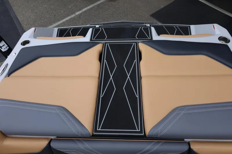 Slide: The Image of 2026 ATX Surf Boats 22 Type-S interior with tan and gray seating, geometric design. - 63