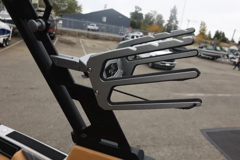 Slide: The Image of ATX Surf Boats 2026 22 Type-S wakeboard rack in a parking lot setting. - 65