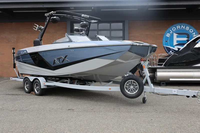Slide: The Image of 2026 ATX Surf Boats 22 Type-S on trailer, parked outside showroom. - 8
