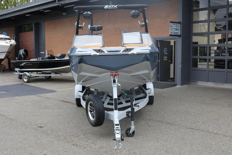 Slide: The Image of 2026 ATX Surf Boats 22 Type-S on trailer outside dealership. - 9