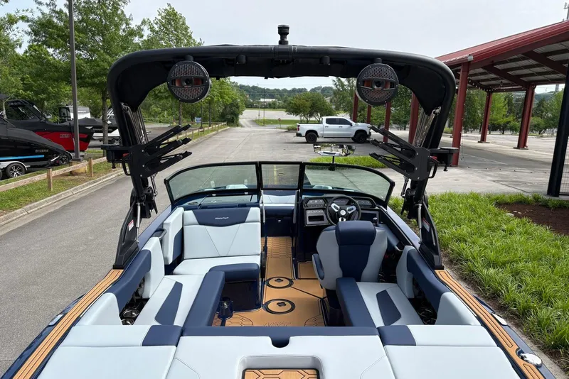 Slide: The Image of 2025 MasterCraft NXT20 boat interior with modern seating and sleek dashboard design. - 7