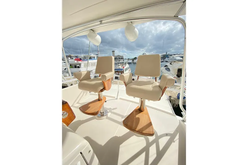 Slide: The Image of Luxury seating on 2012 Tiara Yachts 4800 Convertible, overlooking marina. - 4
