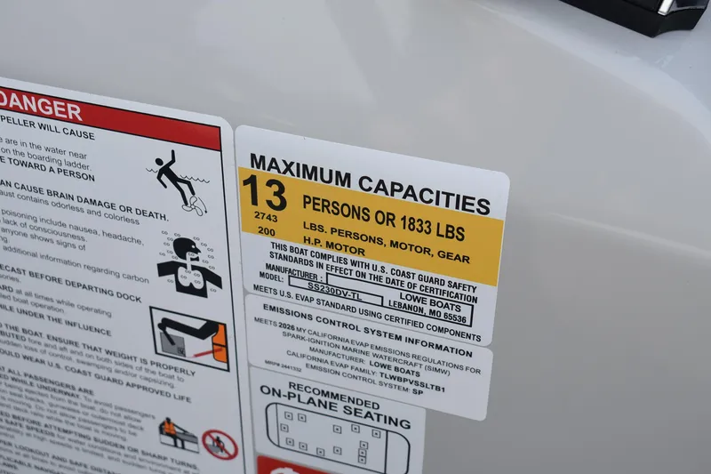 Slide: The Image of Capacity label on 2026 Lowe SS 230 DV boat, maximum 13 persons or 1833 lbs. - 20