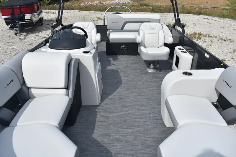 Slide: The Image of 2026 Lowe SS 230 DV pontoon boat interior with plush seating and modern design. - 7