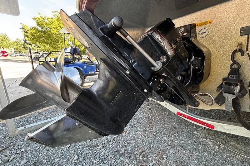 Slide: The Image of Close-up of a 2009 Tahoe Q5i Sport boat's propeller and engine components. - 11