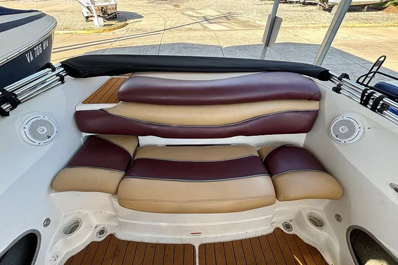Slide: The Image of 2009 Tahoe Q5i Sport boat interior with cushioned seating and speakers. - 7