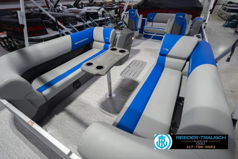 Slide: The Image of 2026 Bennington 23 SSB pontoon boat interior with blue and gray seating. - 12