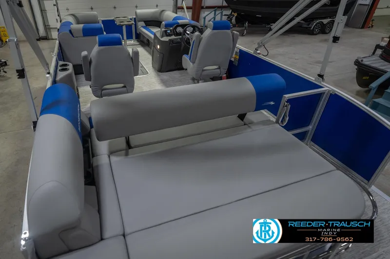Slide: The Image of 2026 Bennington 23 SSB pontoon boat interior with blue and gray seating. - 15