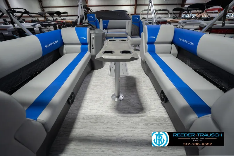 Slide: The Image of 2026 Bennington 23 SSB pontoon boat interior with blue and gray seating. - 16