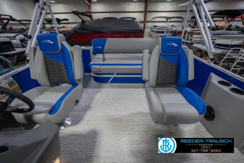 Slide: The Image of 2026 Bennington 23 SSB pontoon boat interior with blue and gray seating. - 17