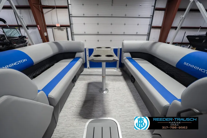 Slide: The Image of 2026 Bennington 23 SSB pontoon boat interior with gray and blue seating. - 21