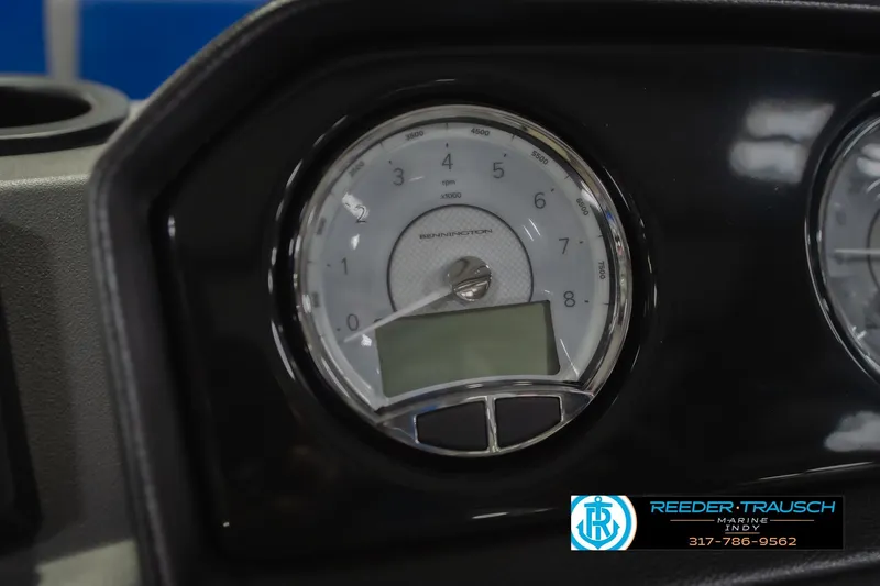 Slide: The Image of Close-up of 2026 Bennington 23 SSB boat dashboard with tachometer and logo. - 35