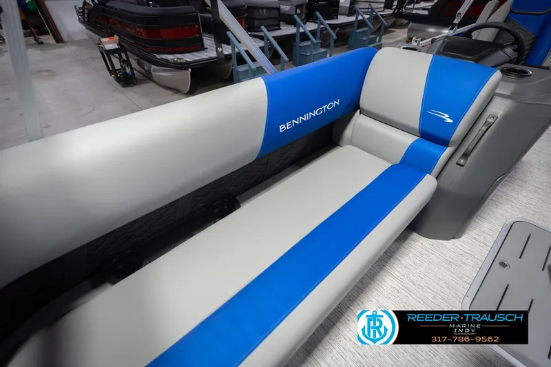 Slide: The Image of 2026 Bennington 23 SSB boat interior with blue and gray seating at Reeder-Trausch Marine. - 44