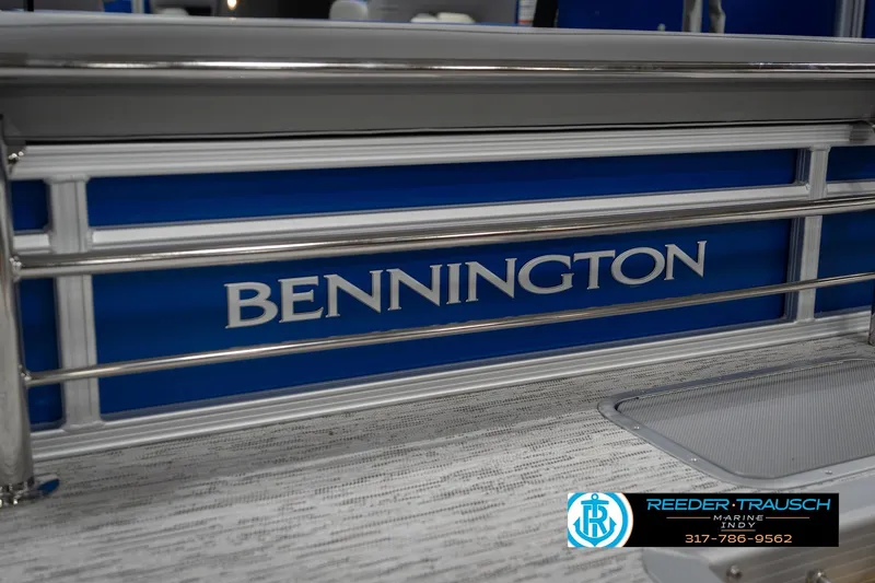 Slide: The Image of 2026 Bennington 23 SSB boat with blue paneling and silver railing. - 51