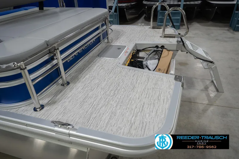 Slide: The Image of 2026 Bennington 23 SSB boat deck with storage compartment and ladder. - 52