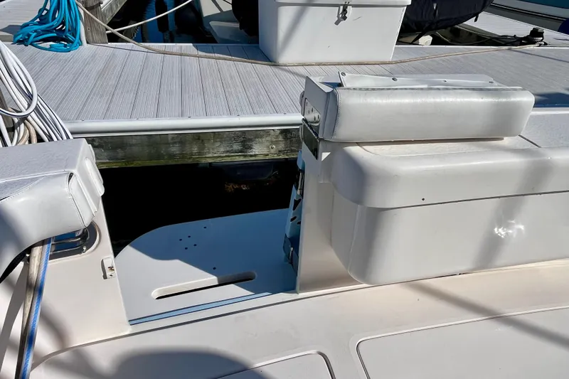 Slide: The Image of 2006 Bertram 390 Convertible boat deck with storage compartments and seating. - 10