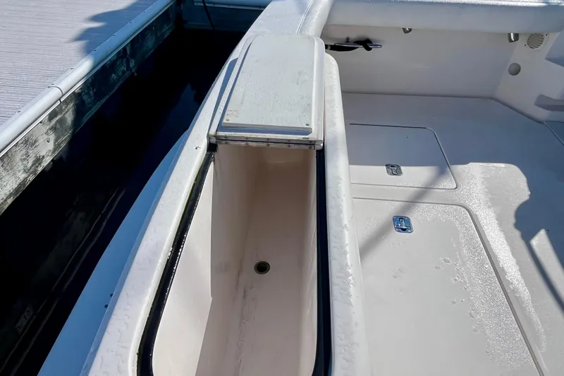 Slide: The Image of 2006 Bertram 390 Convertible yacht with open storage compartments and sink on deck. - 22