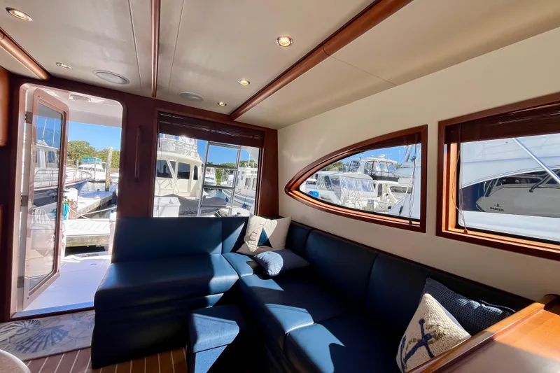 Slide: The Image of Open storage compartment on 2006 Bertram 390 Convertible boat, containing cleaning supplies. - 26