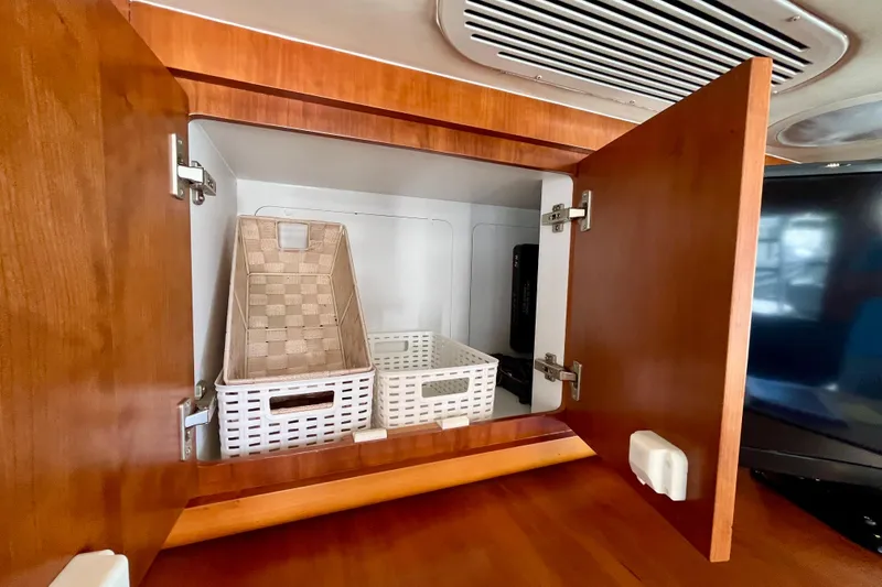 Slide: The Image of 2006 Bertram 390 Convertible yacht interior with modern kitchen and seating area. - 30