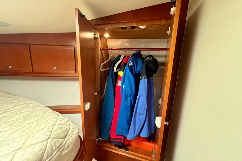 Slide: The Image of Wooden drawer under bed in 2006 Bertram 390 Convertible yacht interior. - 35