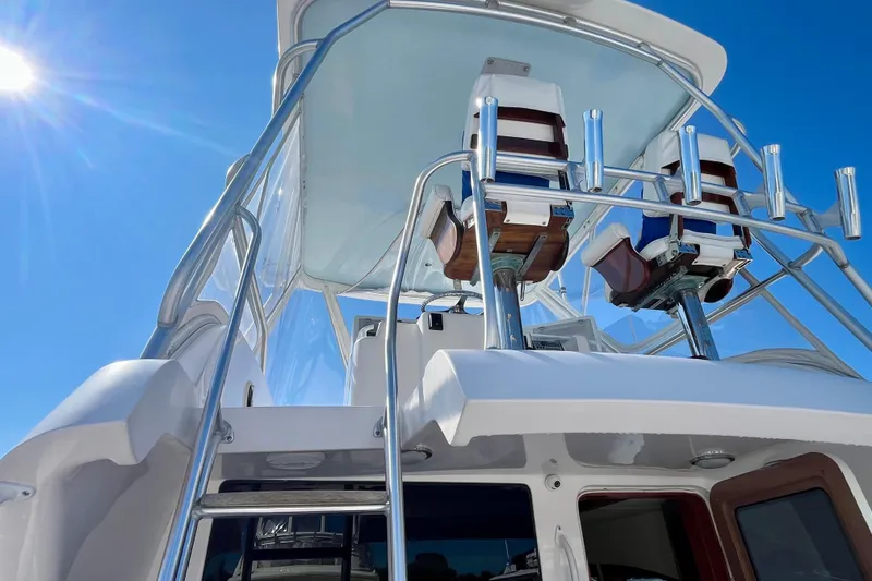 Slide: The Image of Luxurious bathroom in 2006 Bertram 390 Convertible yacht with wood accents and modern fixtures. - 41