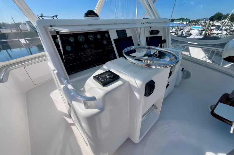 Slide: The Image of 2006 Bertram 390 Convertible yacht with flybridge under clear blue sky. - 42