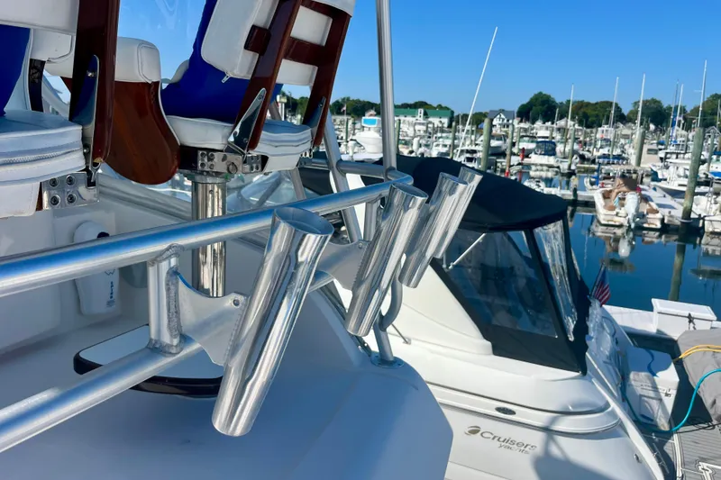 Slide: The Image of Helm of 2006 Bertram 390 Convertible yacht with navigation instruments and steering wheel. - 44