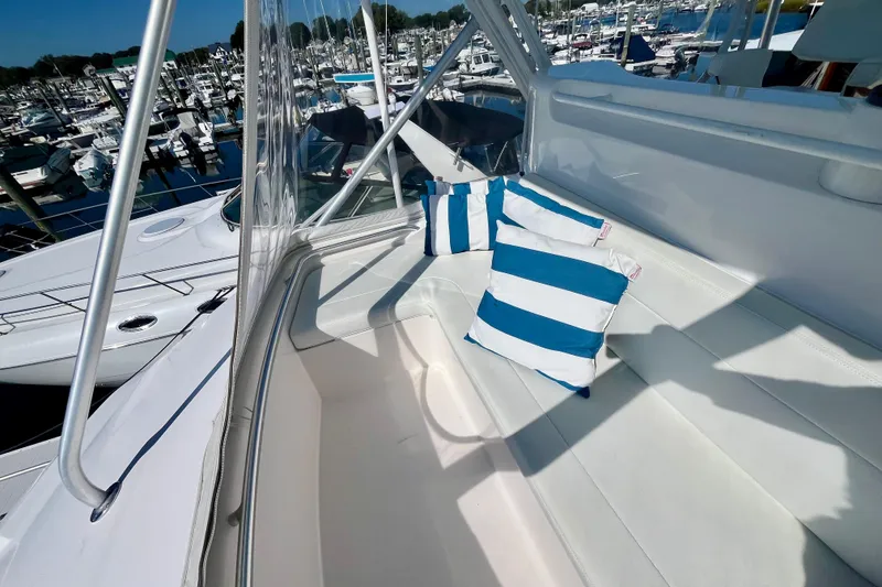Slide: The Image of 2006 Bertram 390 Convertible yacht with helm chairs overlooking marina. - 46
