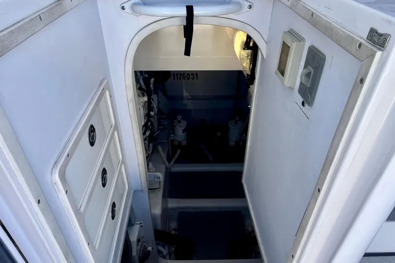 Slide: The Image of 2006 Bertram 390 Convertible yacht interior with open hatch and cabin view. - 48