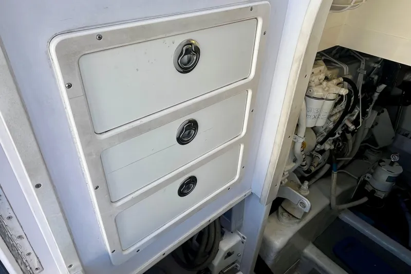 Slide: The Image of Engine room entrance of a 2006 Bertram 390 Convertible boat. - 49