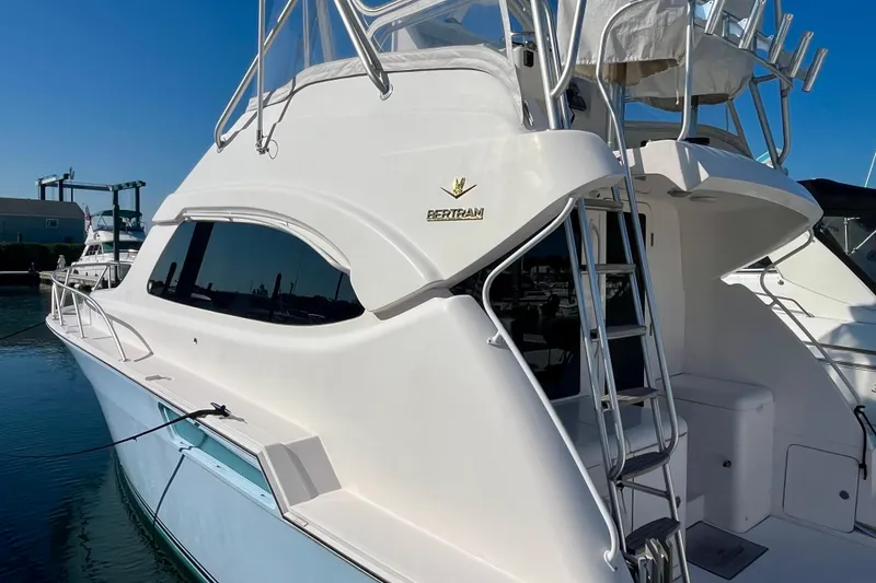 Slide: The Image of Luxurious interior of 2006 Bertram 390 Convertible yacht with elegant wood finishes and seating. - 5